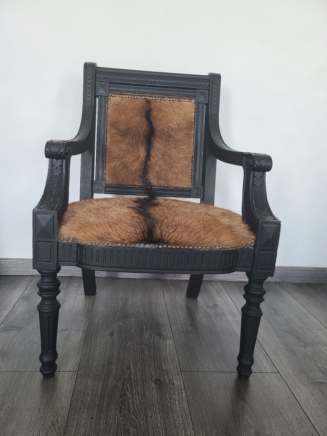 Character armchair in black wood and animal skin #CHMR