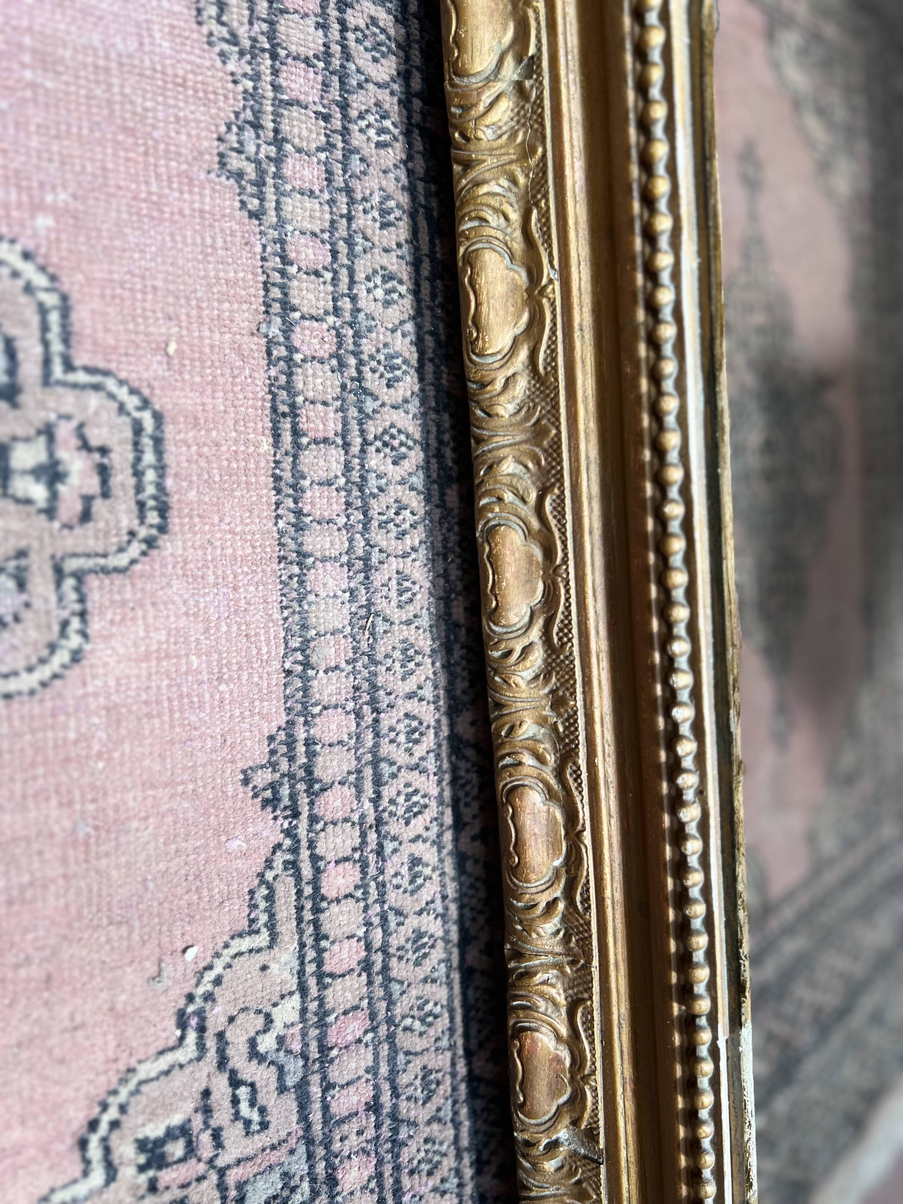 Louis XV style mirror in gilded wood and stucco, 20th century.