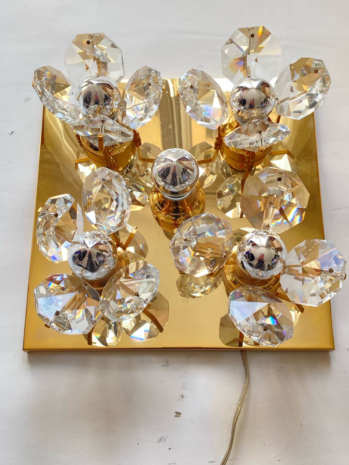 Brass wall lamp with glass prisms