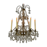 Golden bronze chandelier trimmed with drop-shaped grapevines