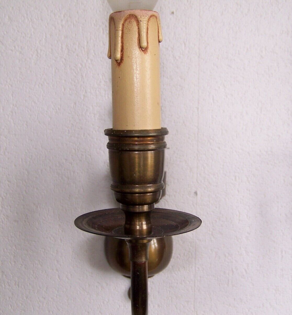 Pair of metal wall sconces