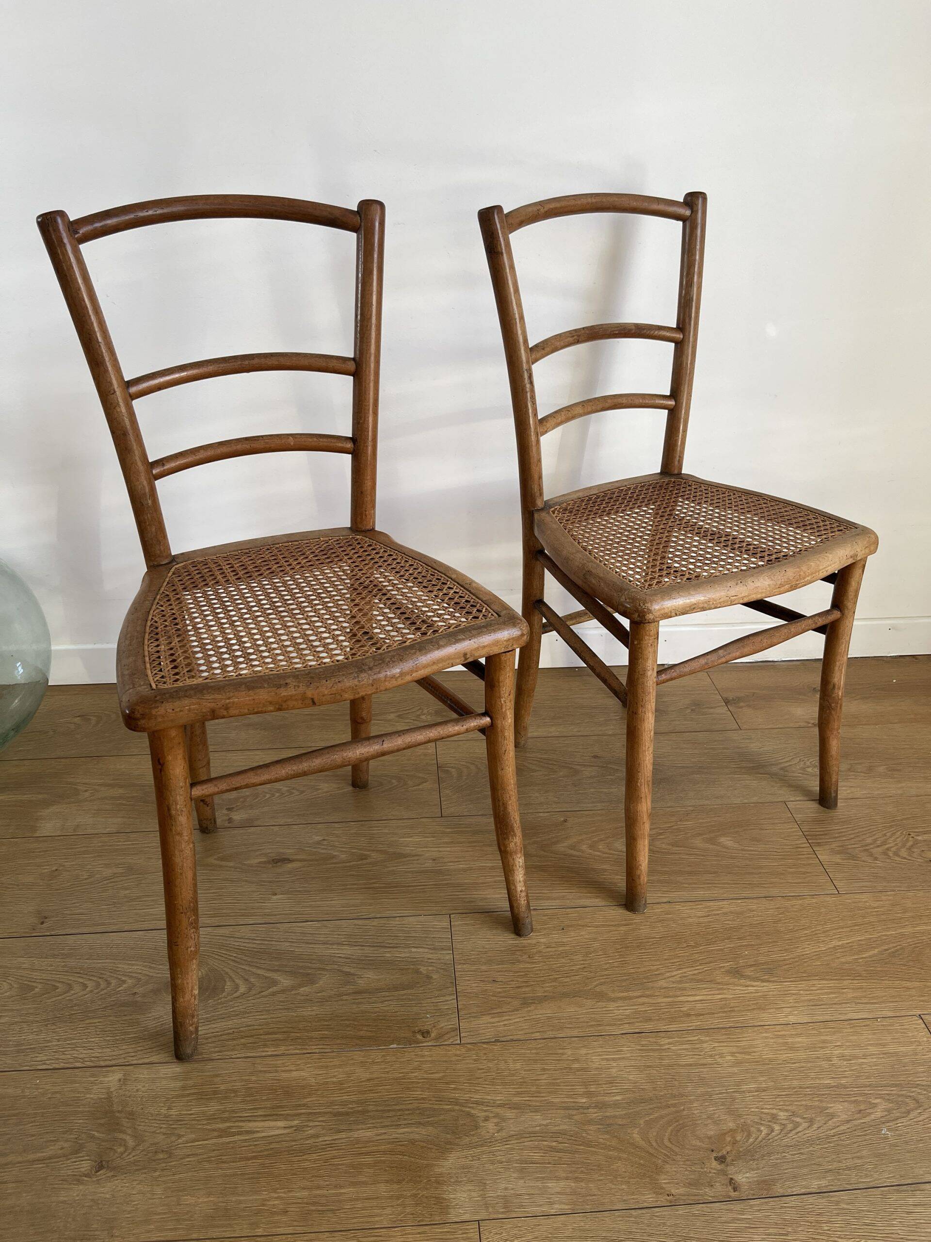 Pair of caned bistro chairs