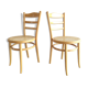 Paire chaises Baumann bois clair et cannage