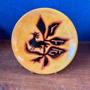 Terracotta plate, Jean Lurçat decorated with a rooster and foliage.