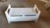 Small white storage bench