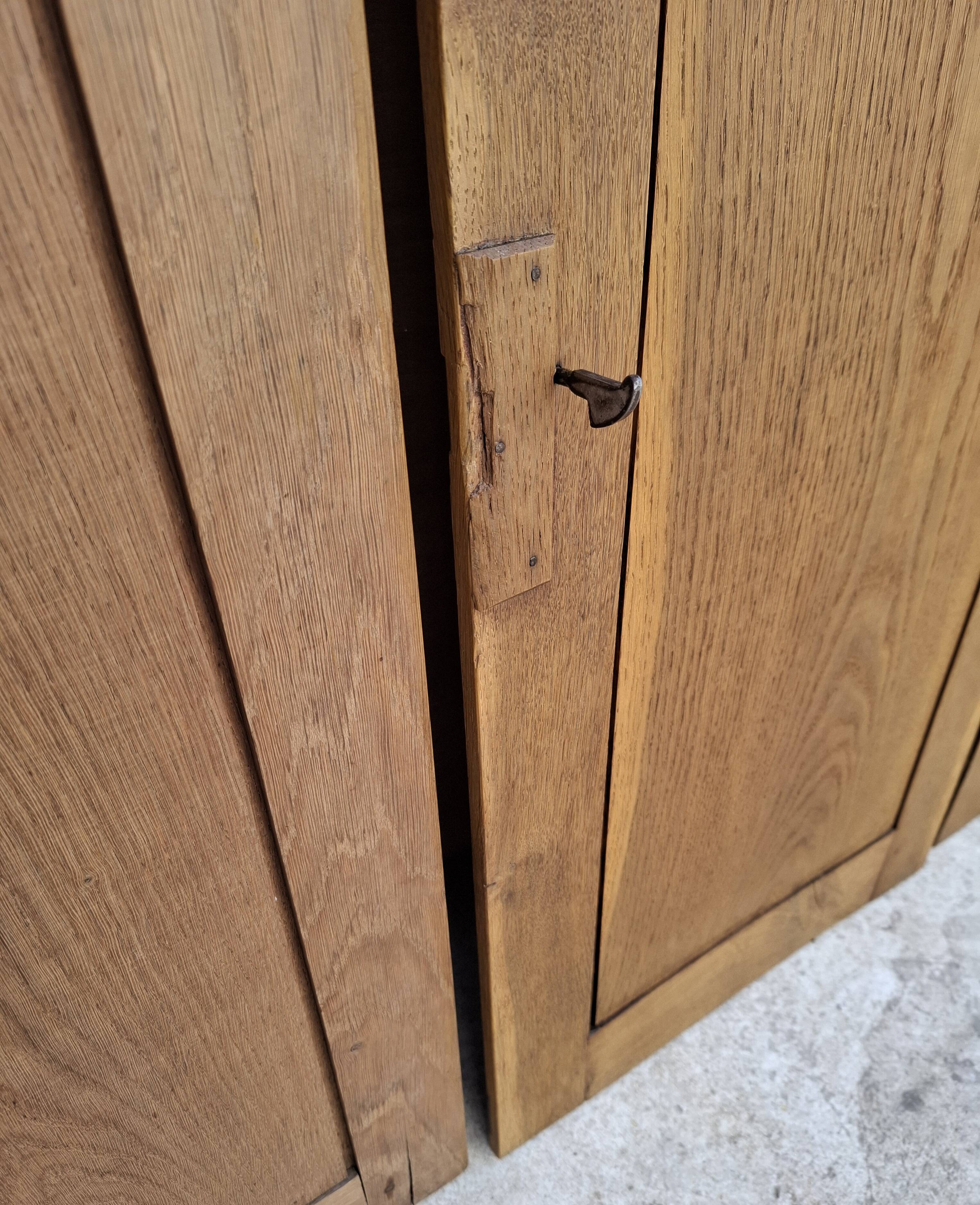 Oak workshop furniture with sliding doors.