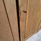 Oak workshop furniture with sliding doors.