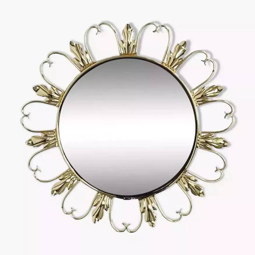 Round mirror on brass frame with scrolls