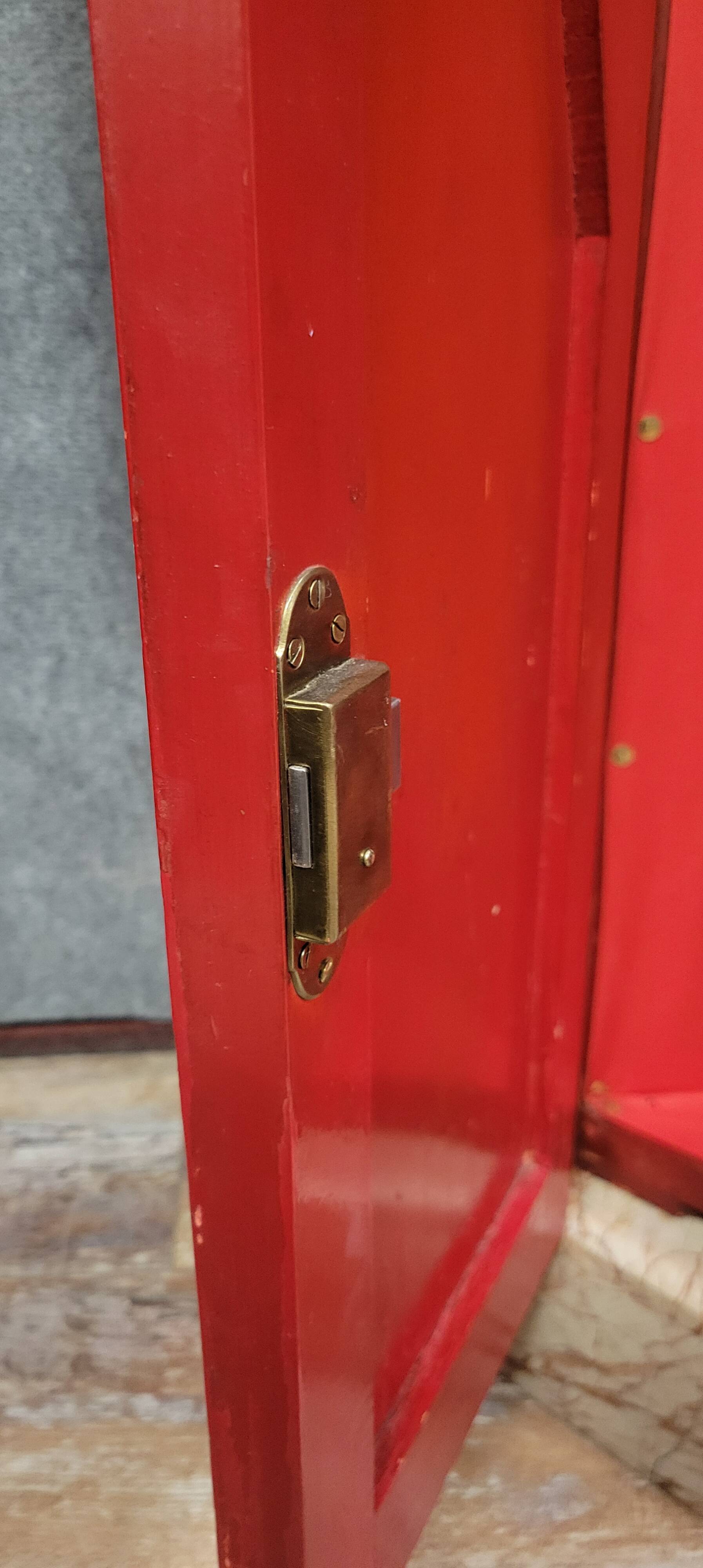 Important Art Deco period bookcase in lacquered wood and gilded bronze