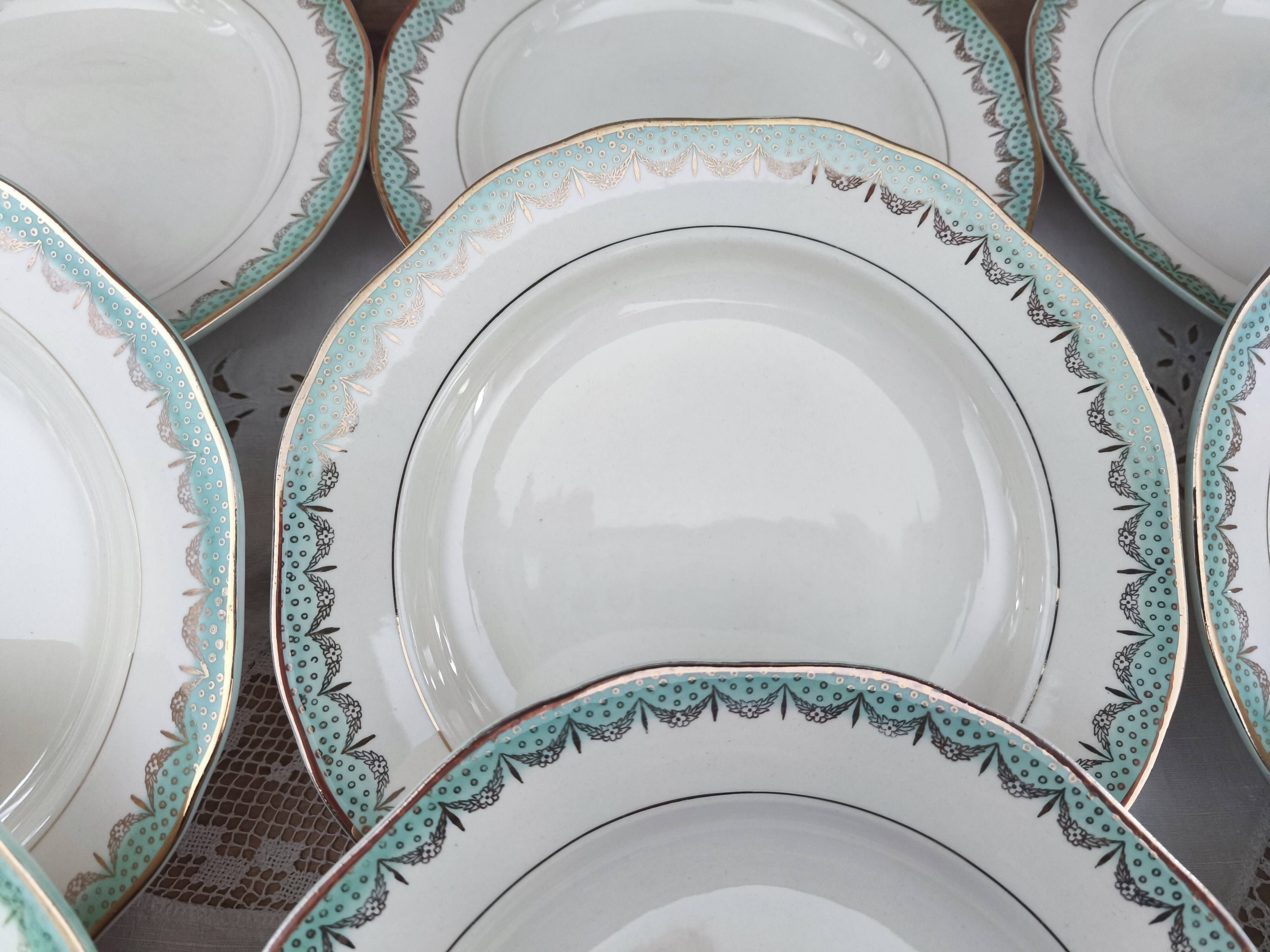 Set of 12 Longwy France earthenware soup plates, Trianon model