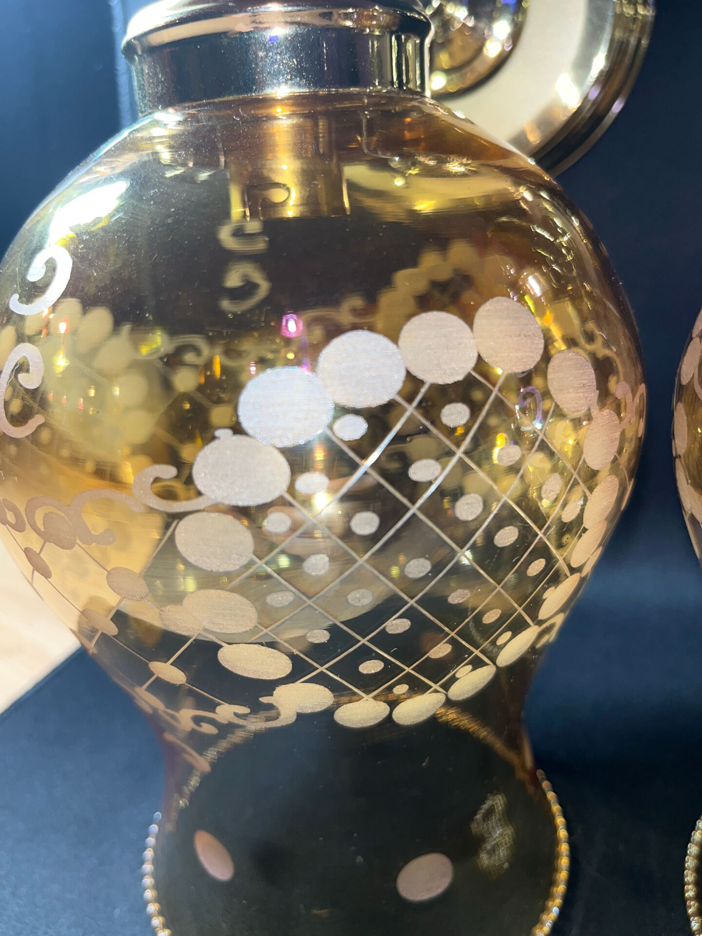 Pair of vintage wall sconces in brass with amber glass globes.