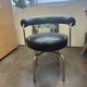 LC7 Swivel Armchair in black leather by Charlotte Perriand for Cassina