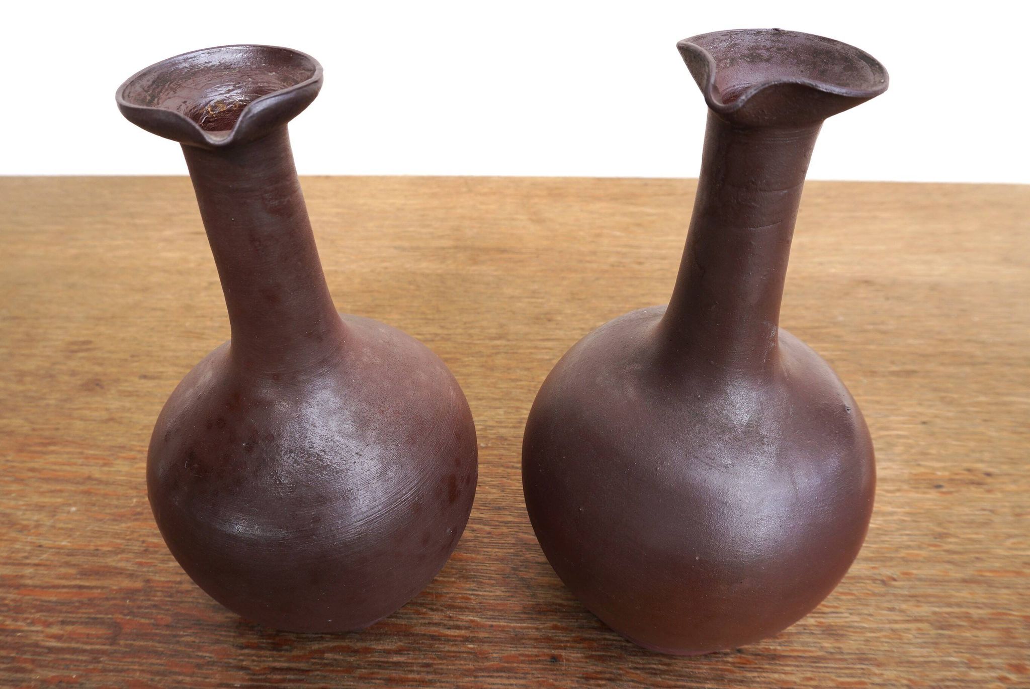 pair of terracotta bottles or carafes