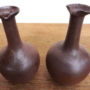 pair of terracotta bottles or carafes