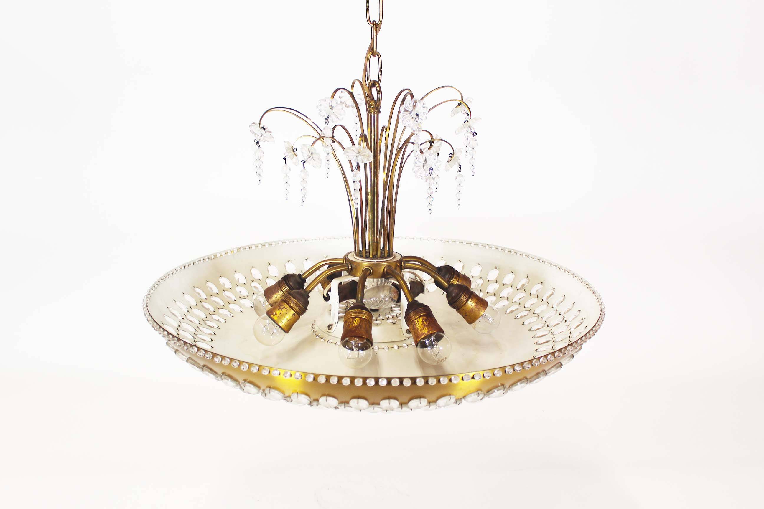 Monumental brass and crystal chandelier from Palwa