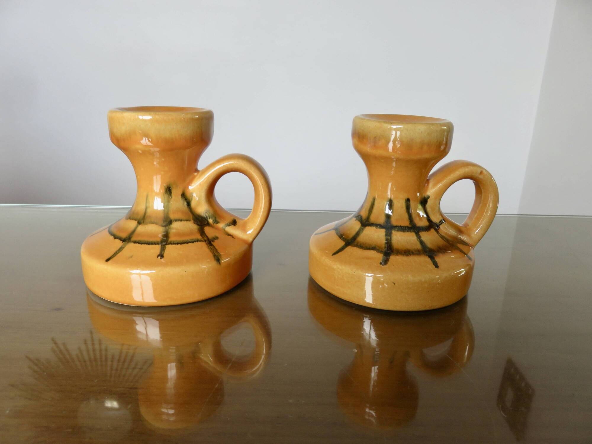 Pair of orange ceramic candlesticks from the 60s