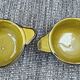 Set of 2 glazed khaki clay bowls.