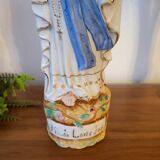 Religious statuette of the Virgin Mary in bisque porcelain