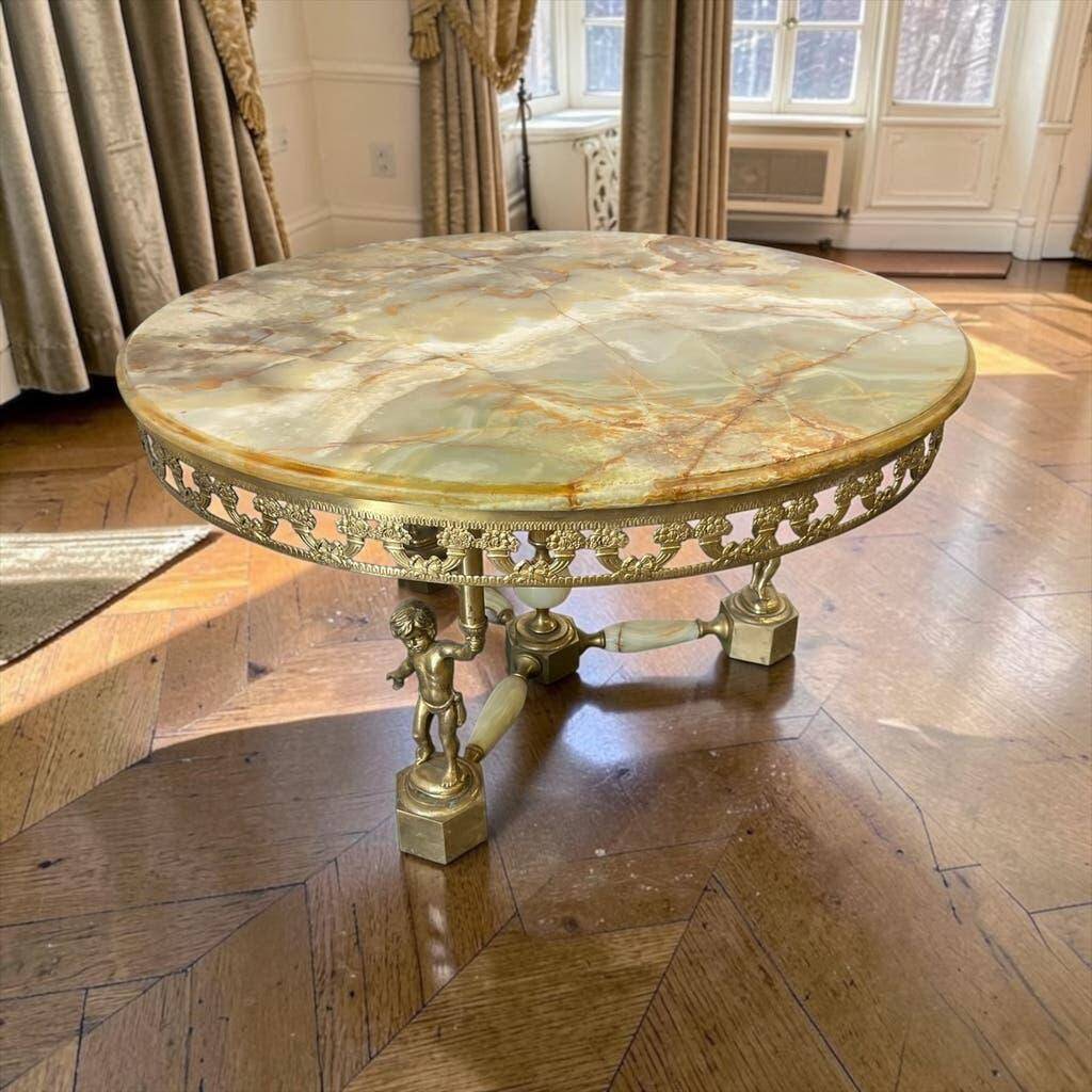 Vintage onyx coffee table with brass frame.