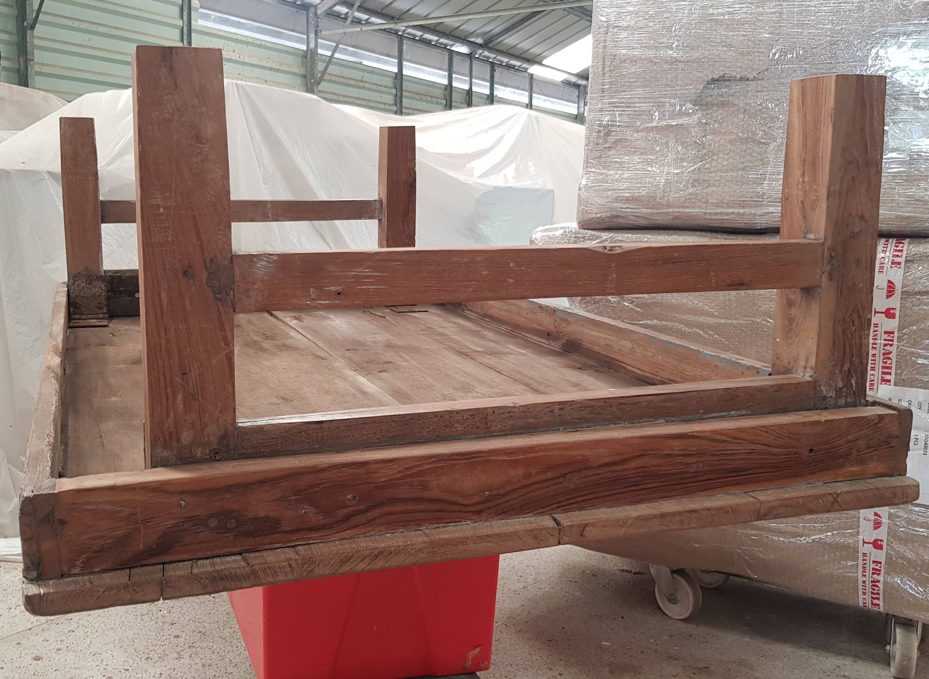 Old industrial workshop coffee table made of solid teak.
