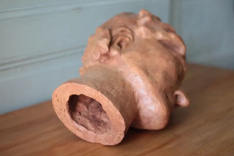 Sculpture signed Doloire, terracotta sculpture, sculpture of a man's head, collection, interior decoration.