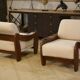 Brutalist pair of armchairs in mahogany and cream boucle 1970s.