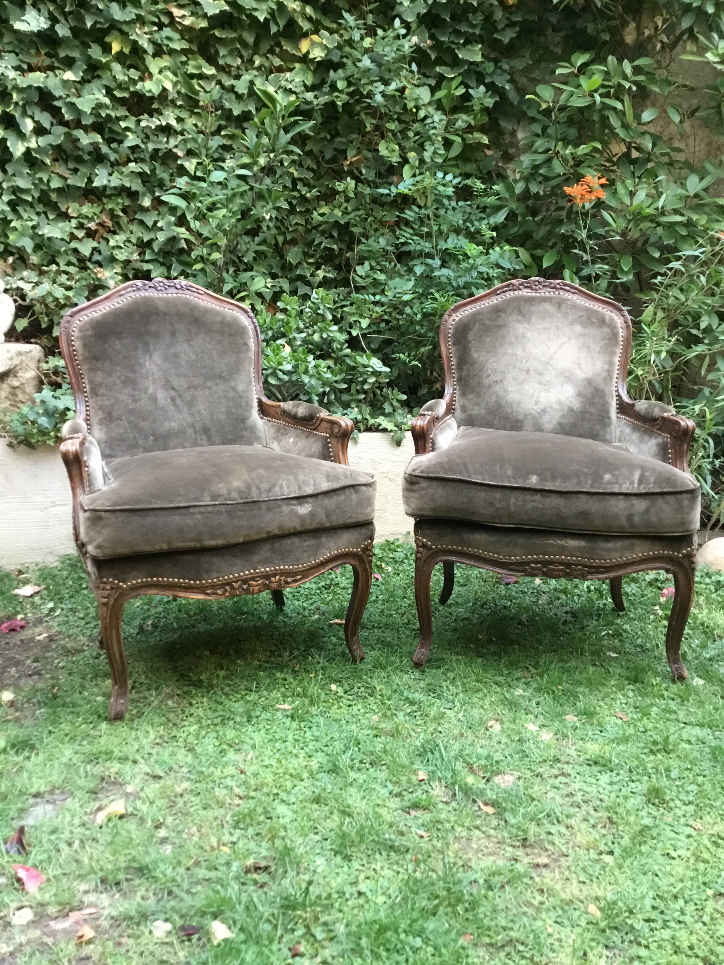 Pair of Louis XV style bergères in moulded and carved wood.