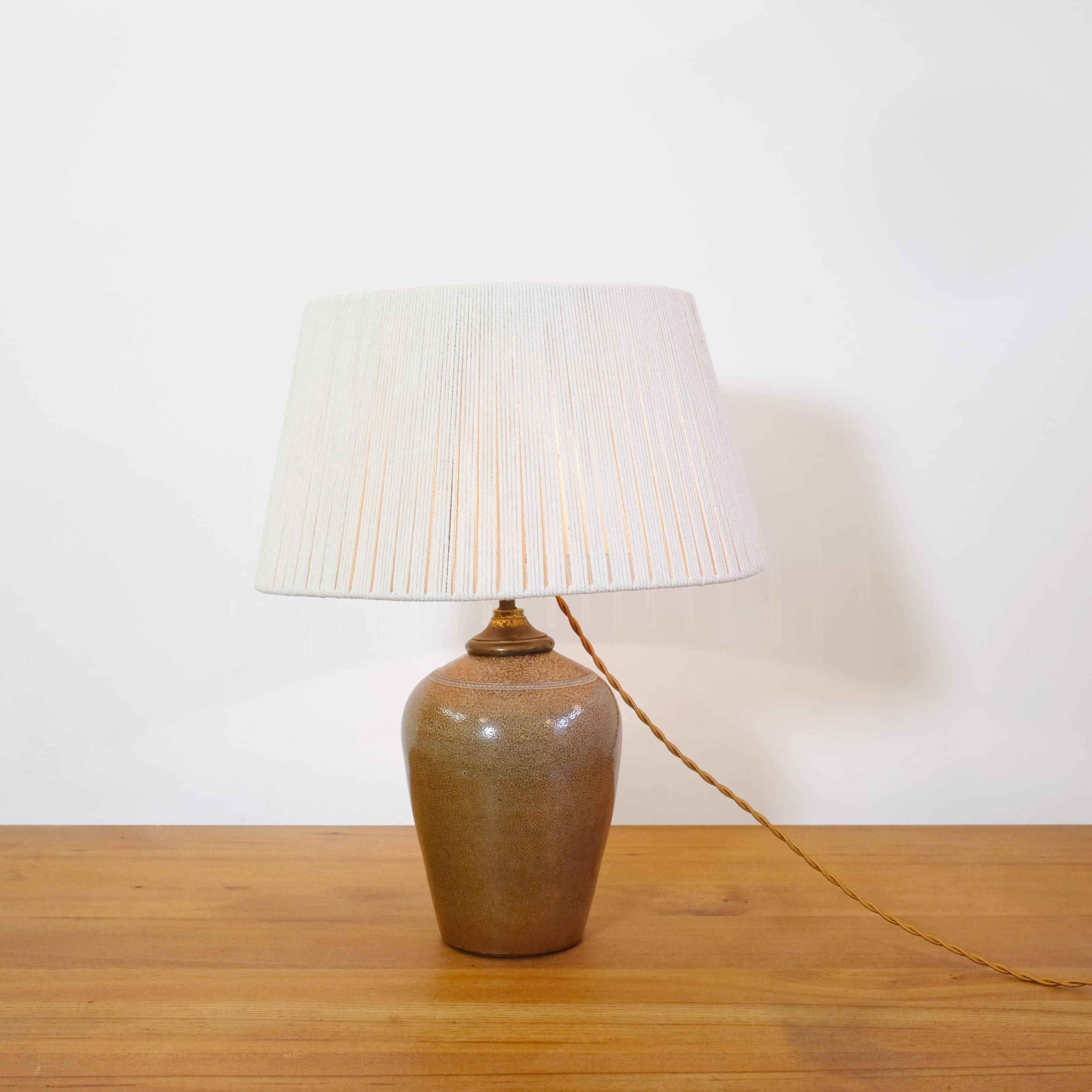 Stoneware lamp with a cotton thread shade, 1970s.