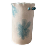 Vase en grès décoré de fleurs dans un style aquarelle.