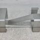 Coffee table with "kinetic" steel base and glass slab. Circa 1970.