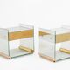Pair of bedside tables or side tables in brass, glass, and mirror. 1970s.