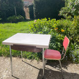 Formica table with a red Mid-century chair.