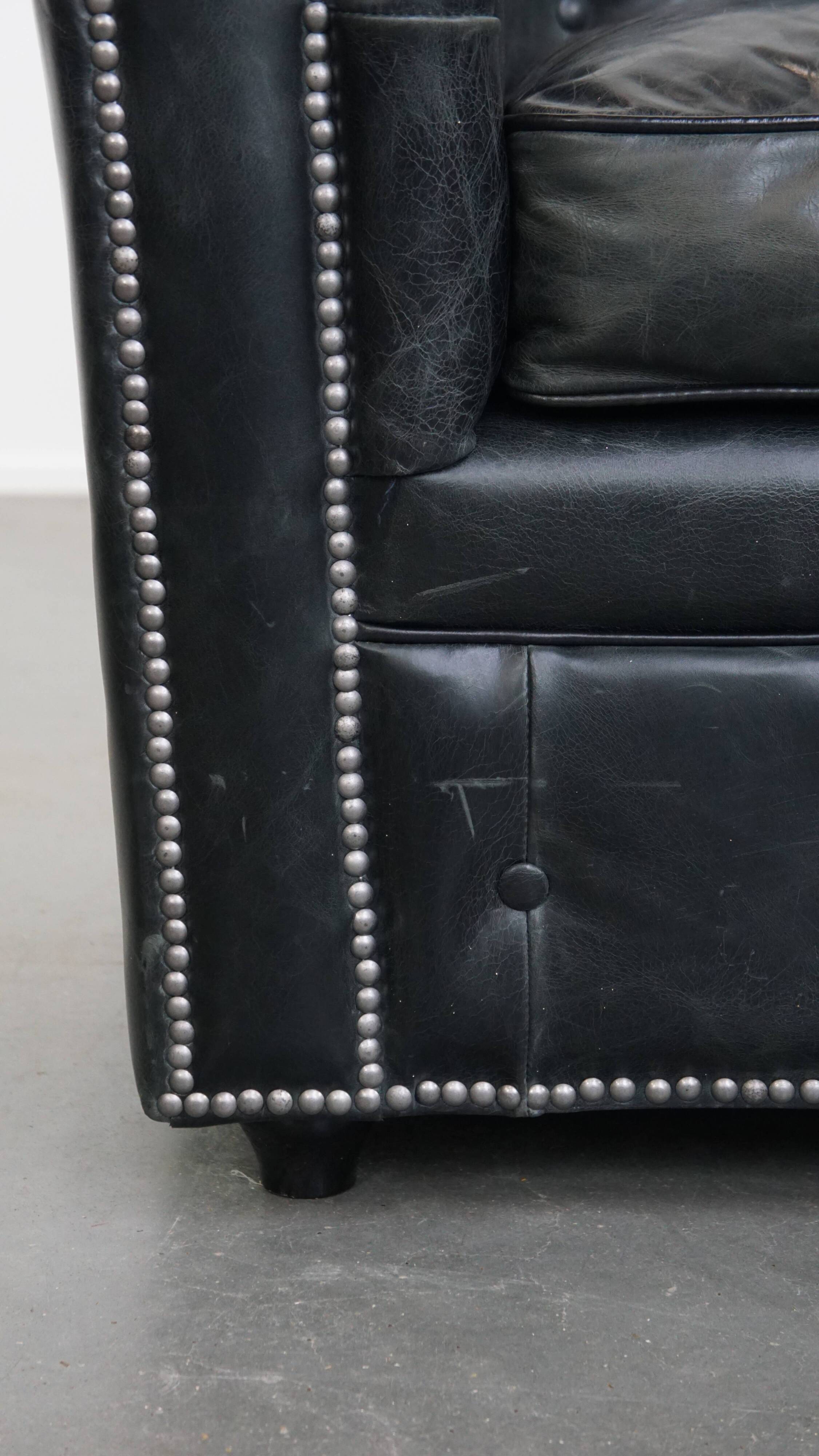 Black cowhide leather chesterfield armchair