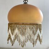 Amber polished glass and pearl suspension