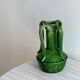 Pottery green ceramic vase with four handles.