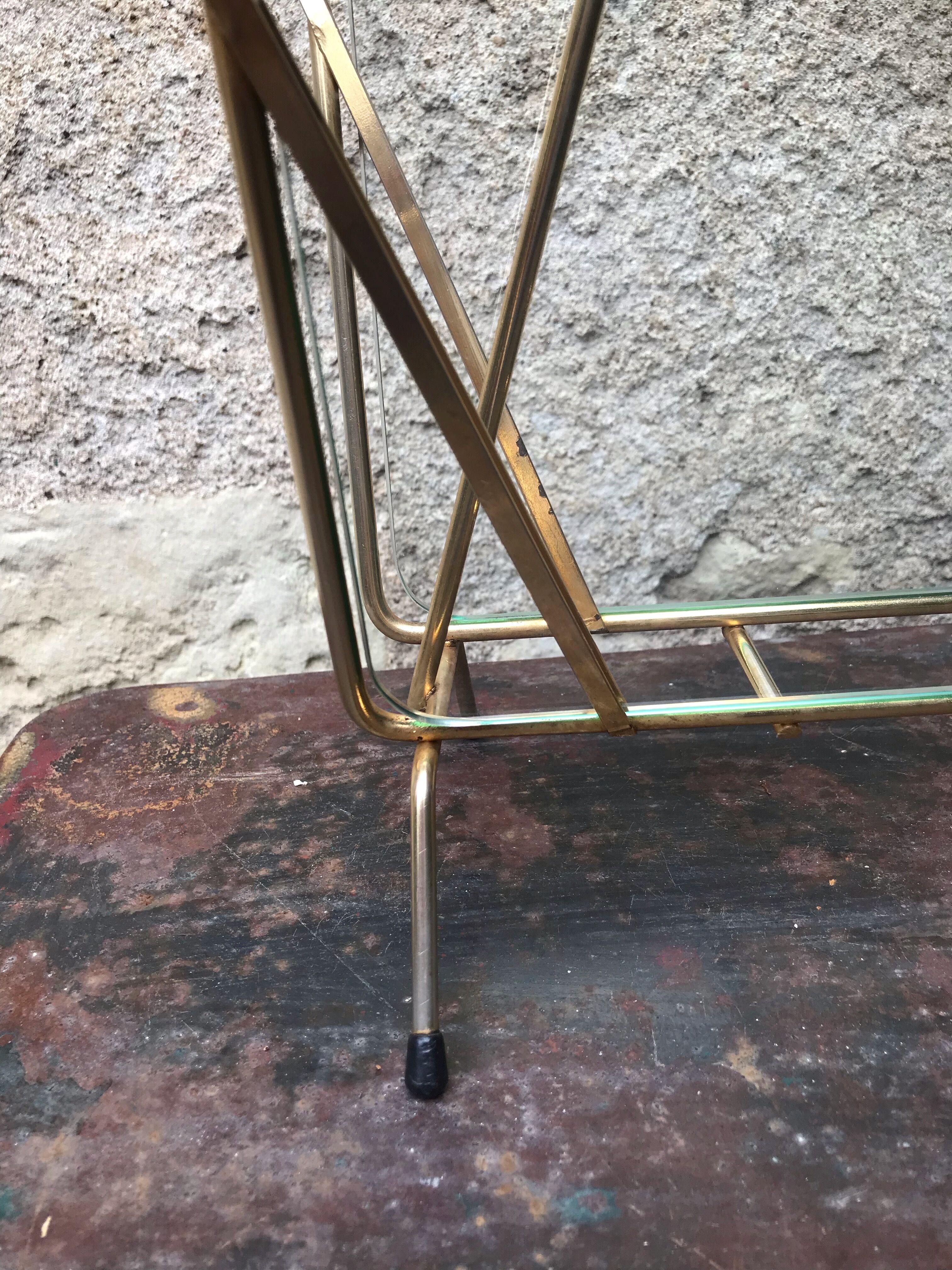 Glass and gold metal magazine door