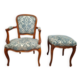 Cabriolet armchair in cherry wood with its footrest, 20th century.