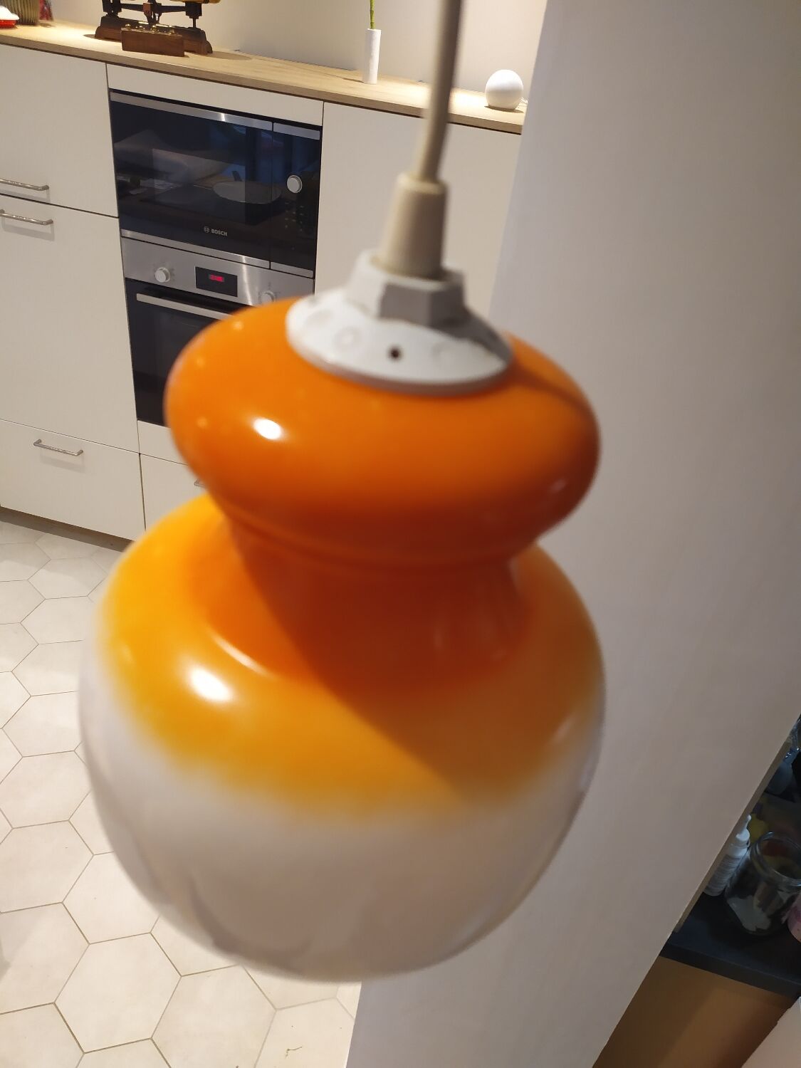 Pendant light in orange and white opaline