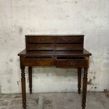 Wooden lady's desk says "happiness of the day"