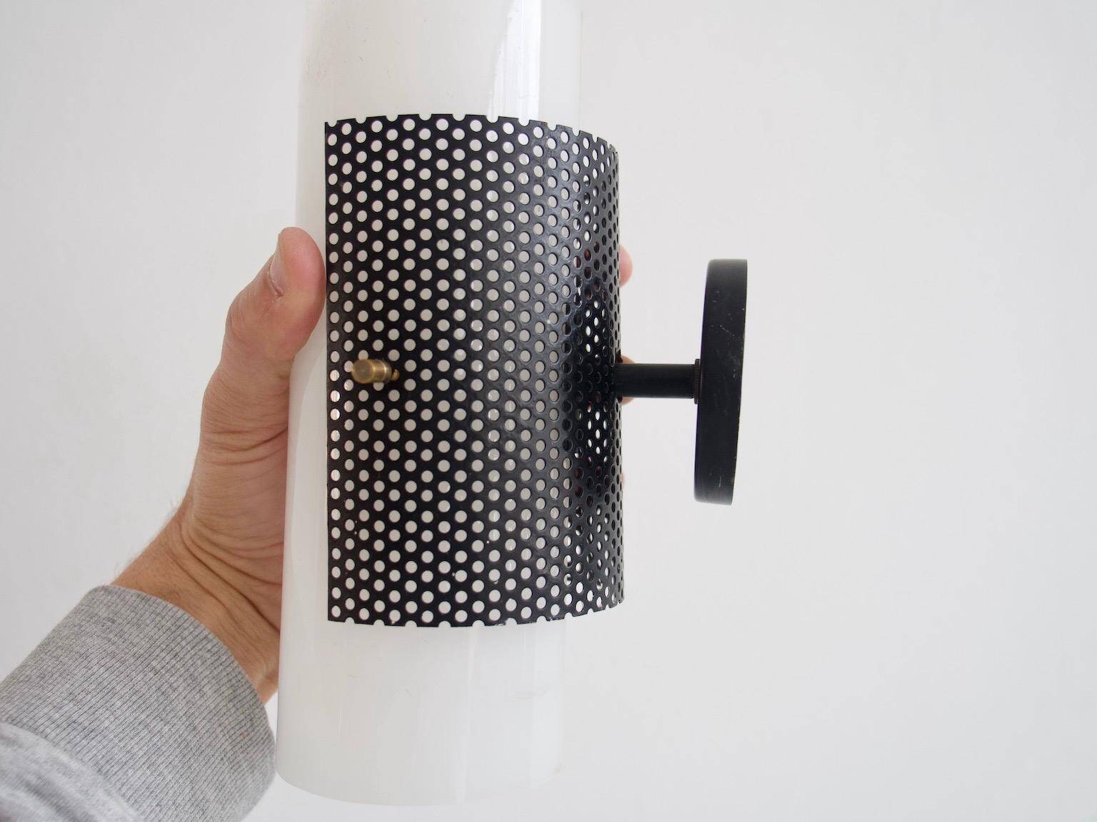 Set of four wall lights in white plexiglass and perforated black metal.
