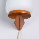 Wall lamp with opal glass shade on wooden base by Philips