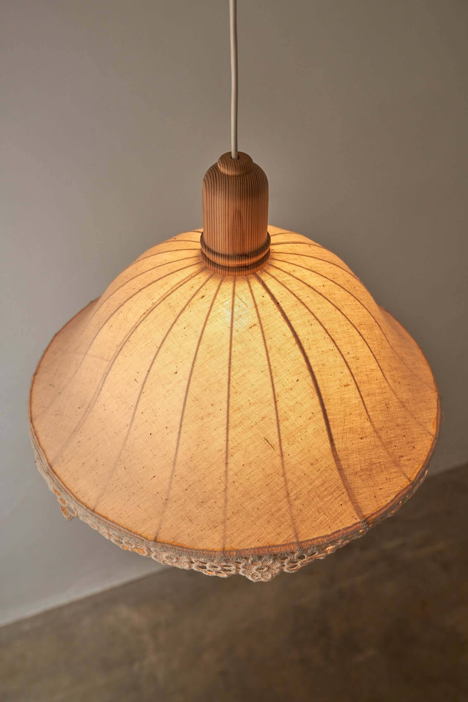 Wood and textile pendant from Sweden