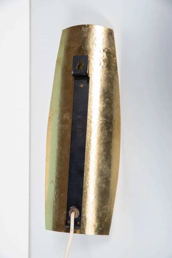 Vintage glass wall sconce from the 1960s in brass, mid-century light.