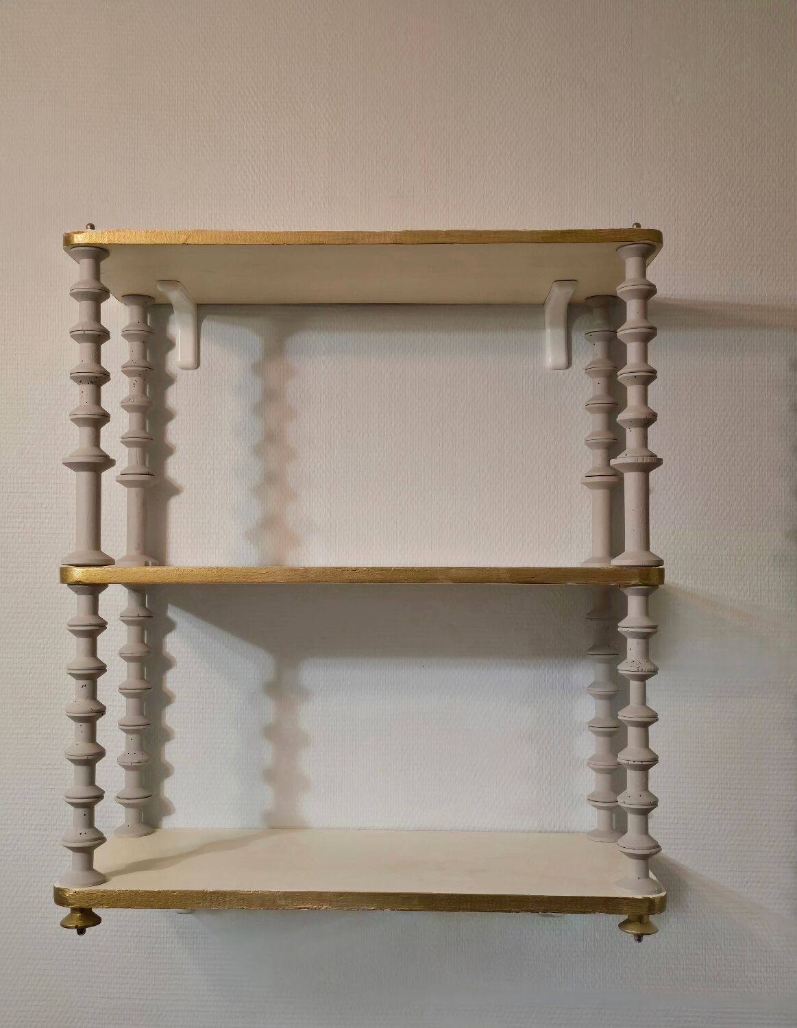 White and gold spool shelf