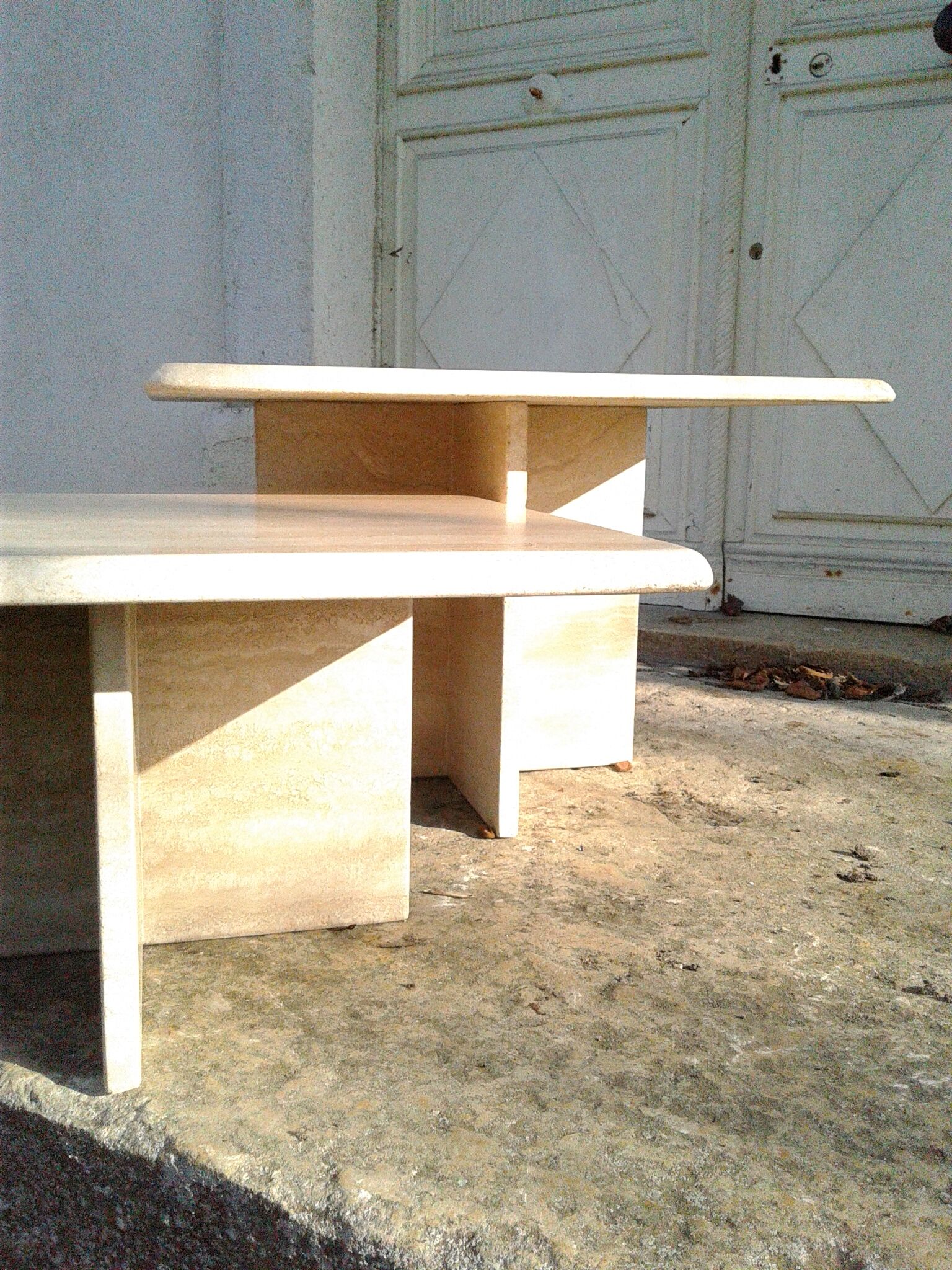 Two coffee tables giggle in travertine
