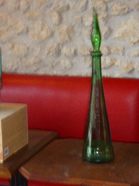 Vintage green faceted glass bottle with its cap 1970
