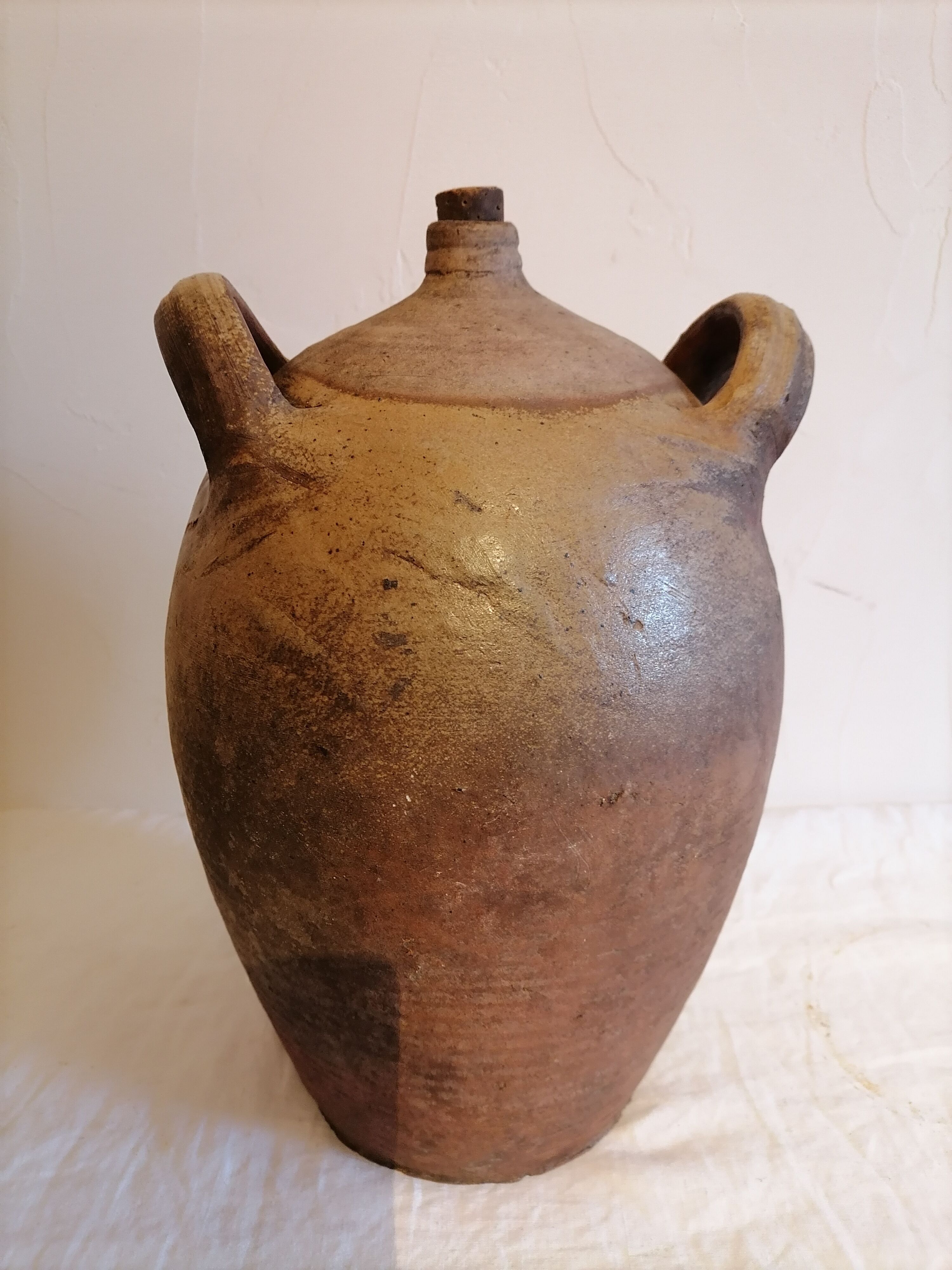 Old jar, glazed sandstone jug. Early twentieth century.