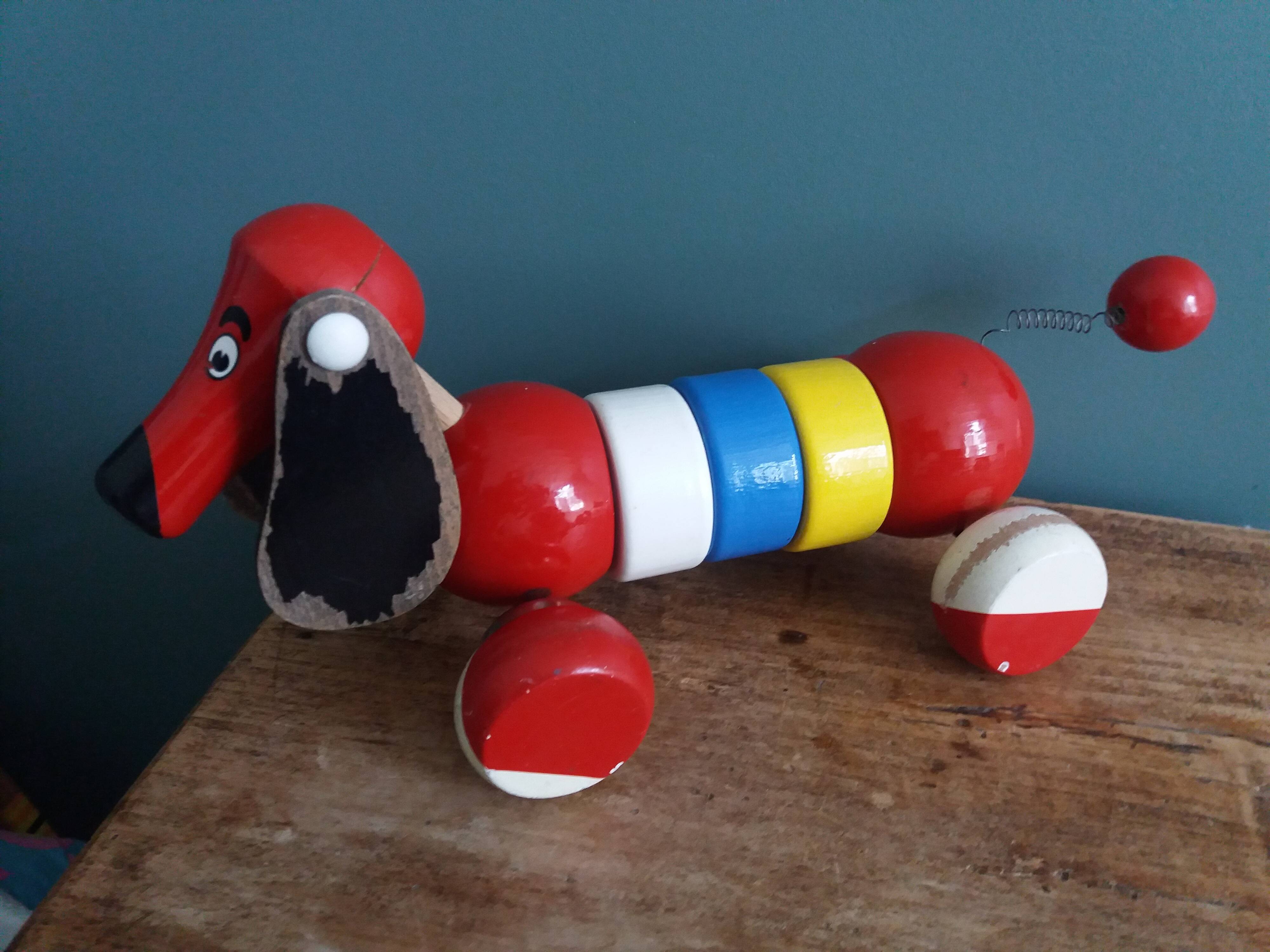 Lacquered wooden pull-along dog toy
