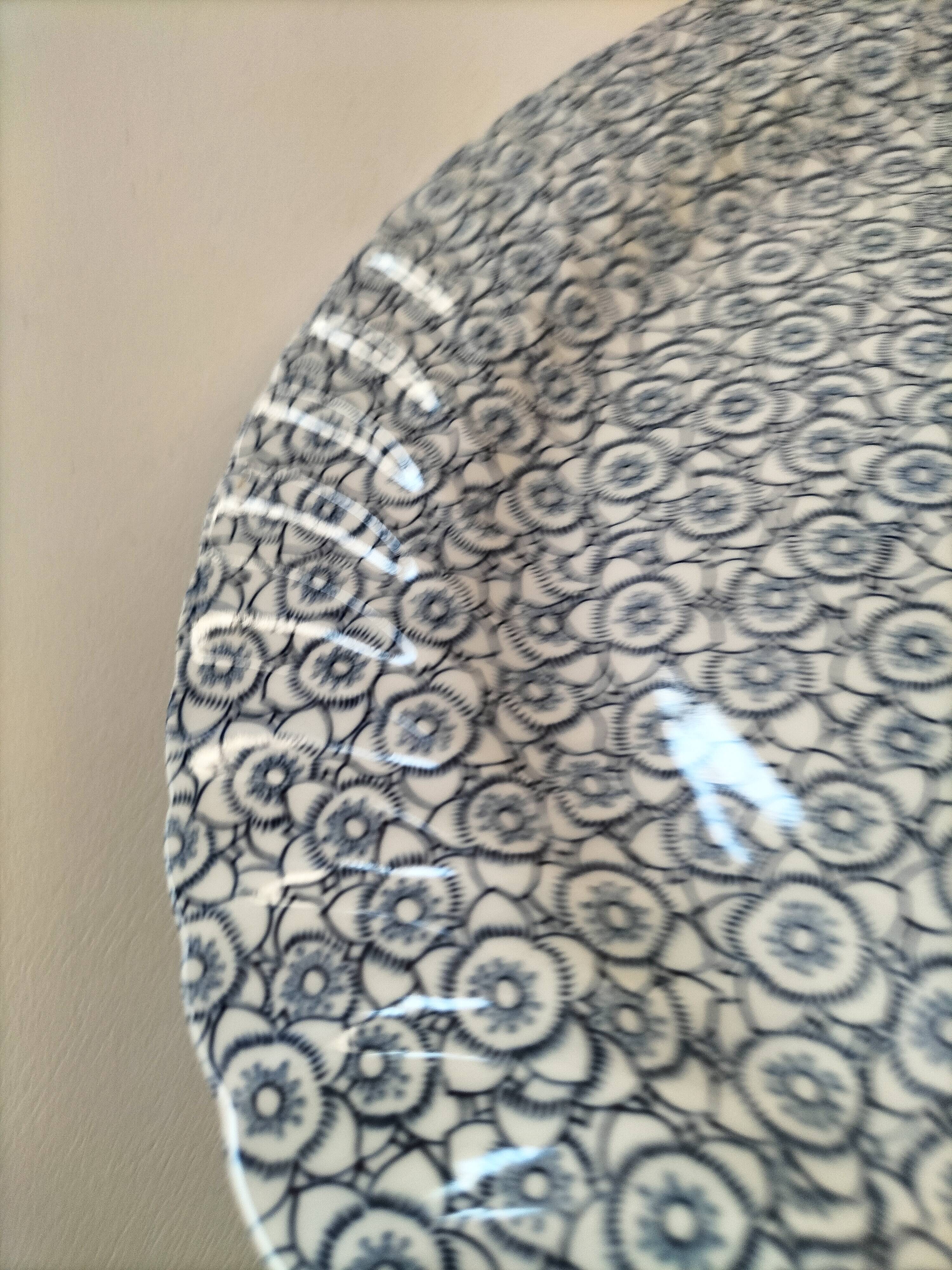 Round antique plate by Johnson Brothers in the Blue Lotus pattern.