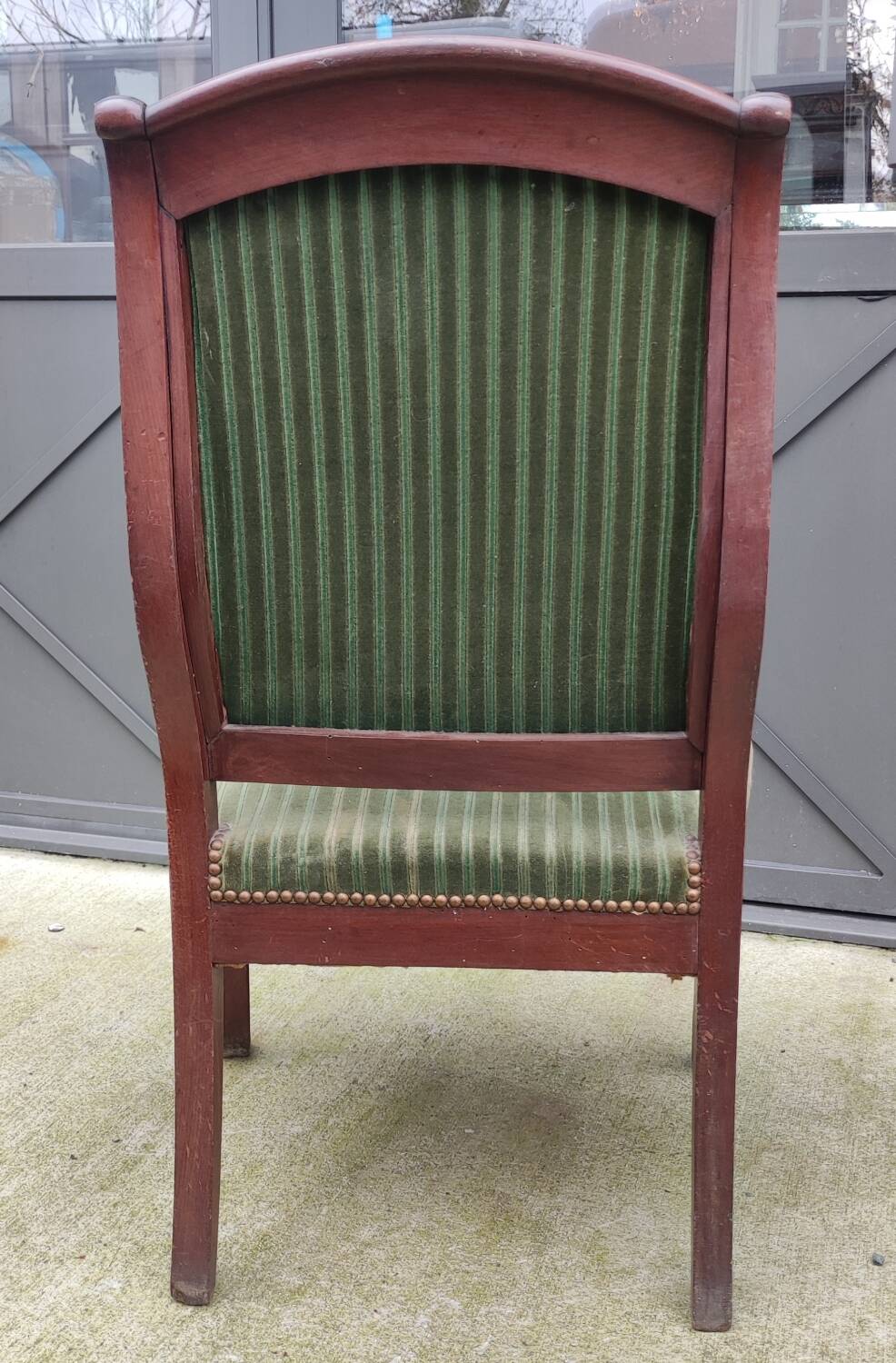 Old green velvet armchair